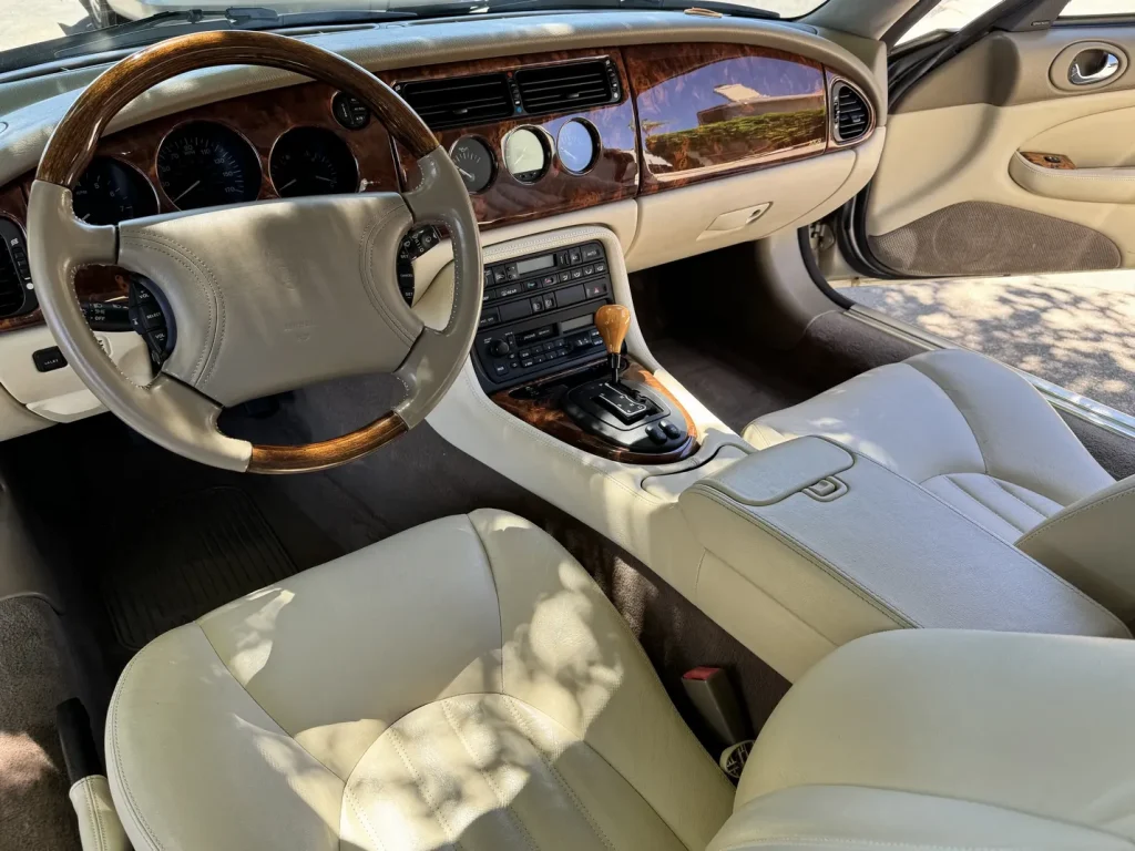 1997 Jaguar XK8 convertible in Topaz Metallic - Walnut Creek Ca. For Sale detail - Interior leather cleaning. Beautiful wood-grain dash.